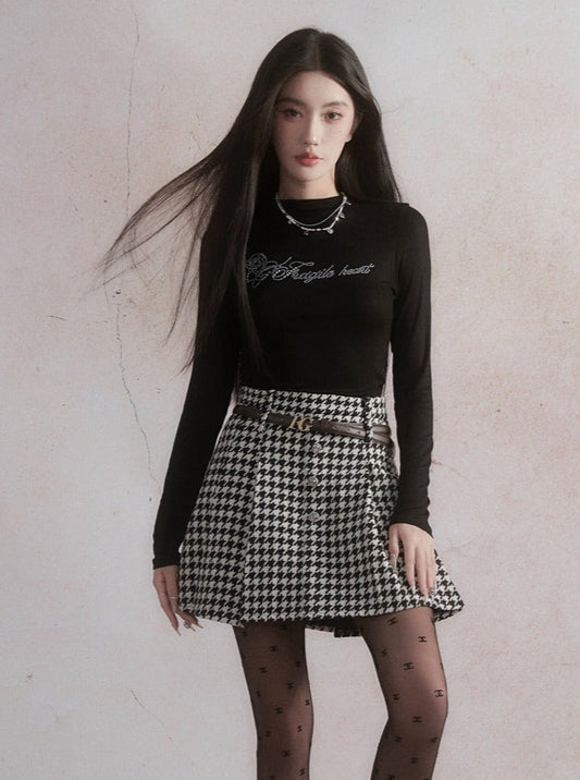 Elegant Contrast: Graphic Crop Top and Houndstooth Skirt Set