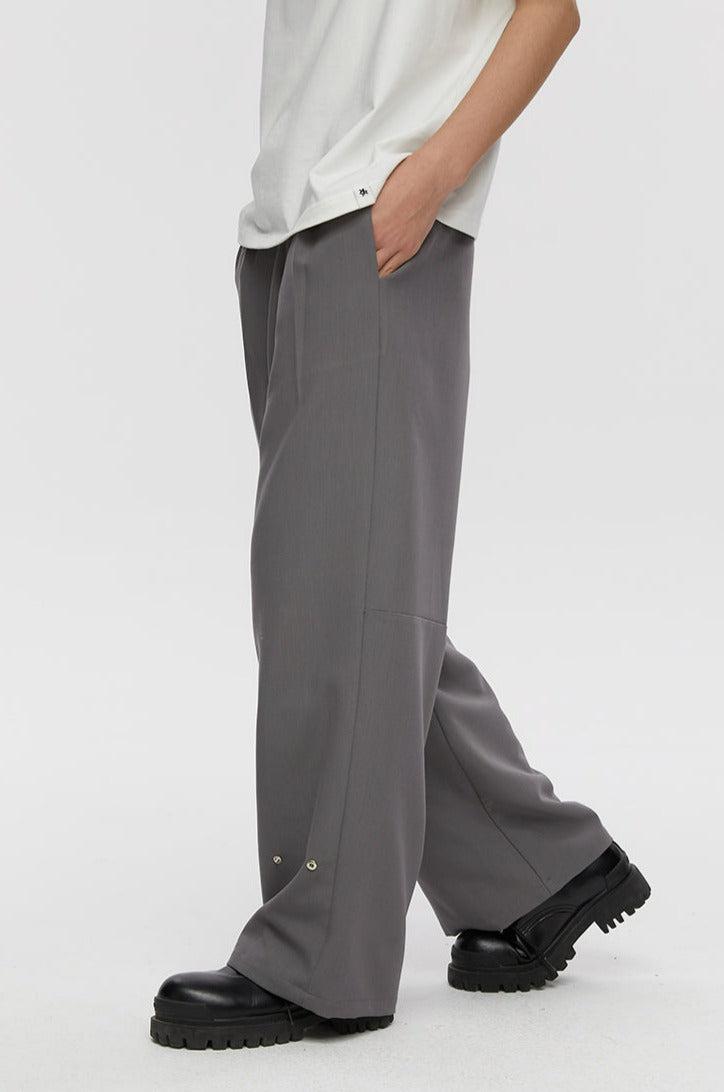 Trousers With Fold And Button Detail