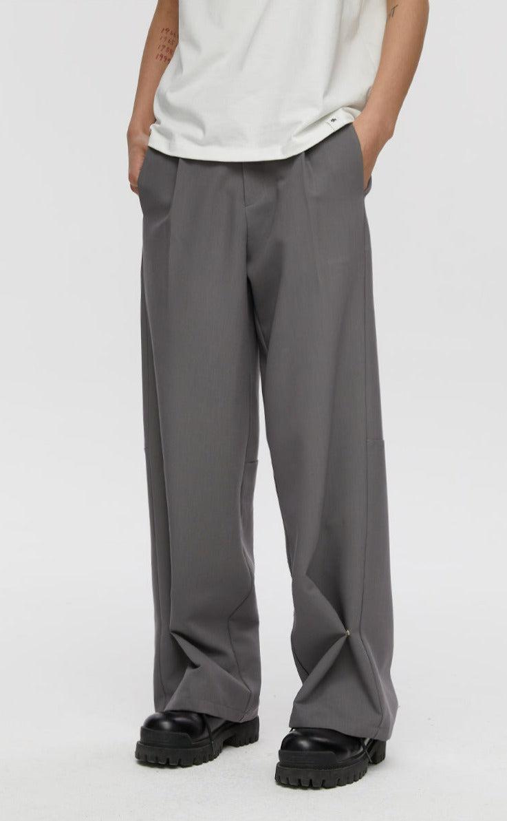 Trousers With Fold And Button Detail