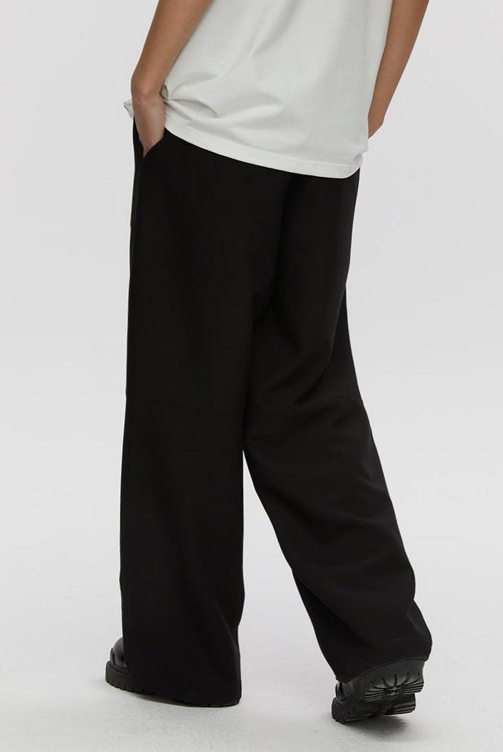 Trousers With Fold And Button Detail