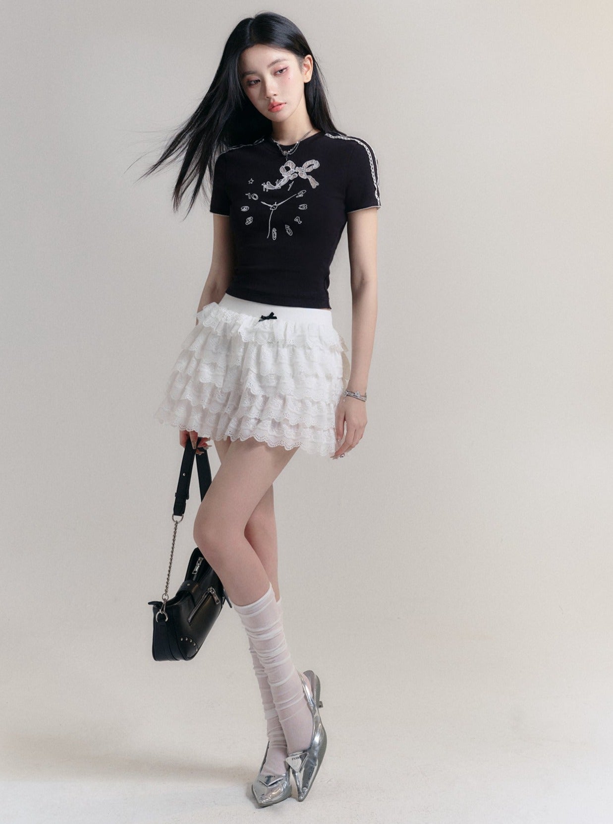 Angelic Tiers Mini Skirt: White Lace Ruffle Layers with Bow Accent